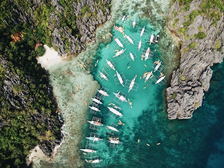 bay aerial view boats shore rocks PNG without background