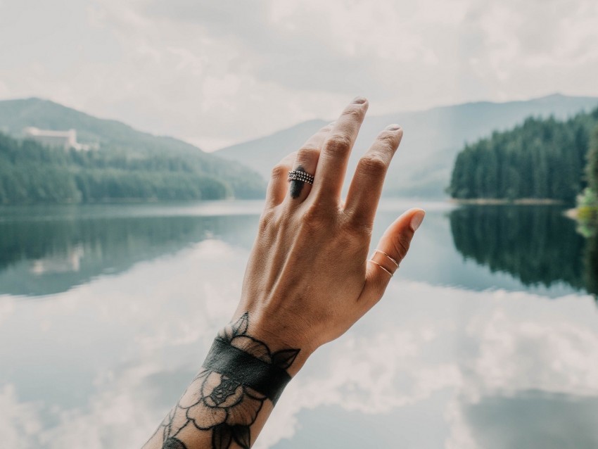 hand tattoos touch lake landscape PNG Graphic with Transparent Isolation